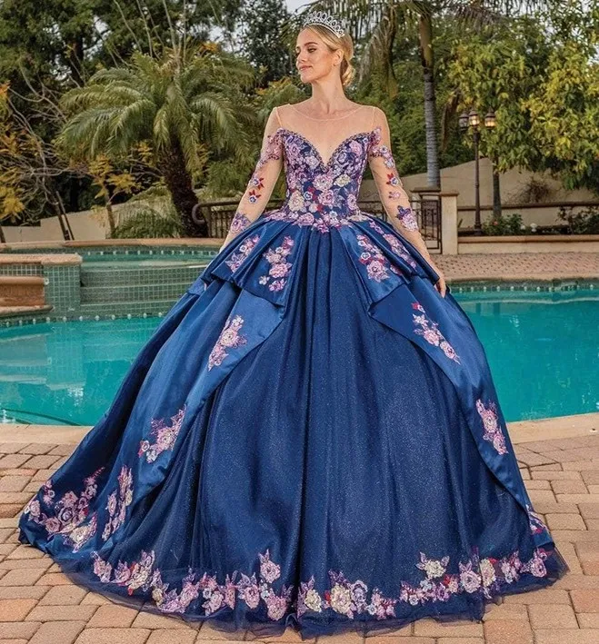 Vestido de 15 años color Navy decorado con apliques multicolor, pedreria en Top, manga larga de Tull con decoraciones y falda corte princesa